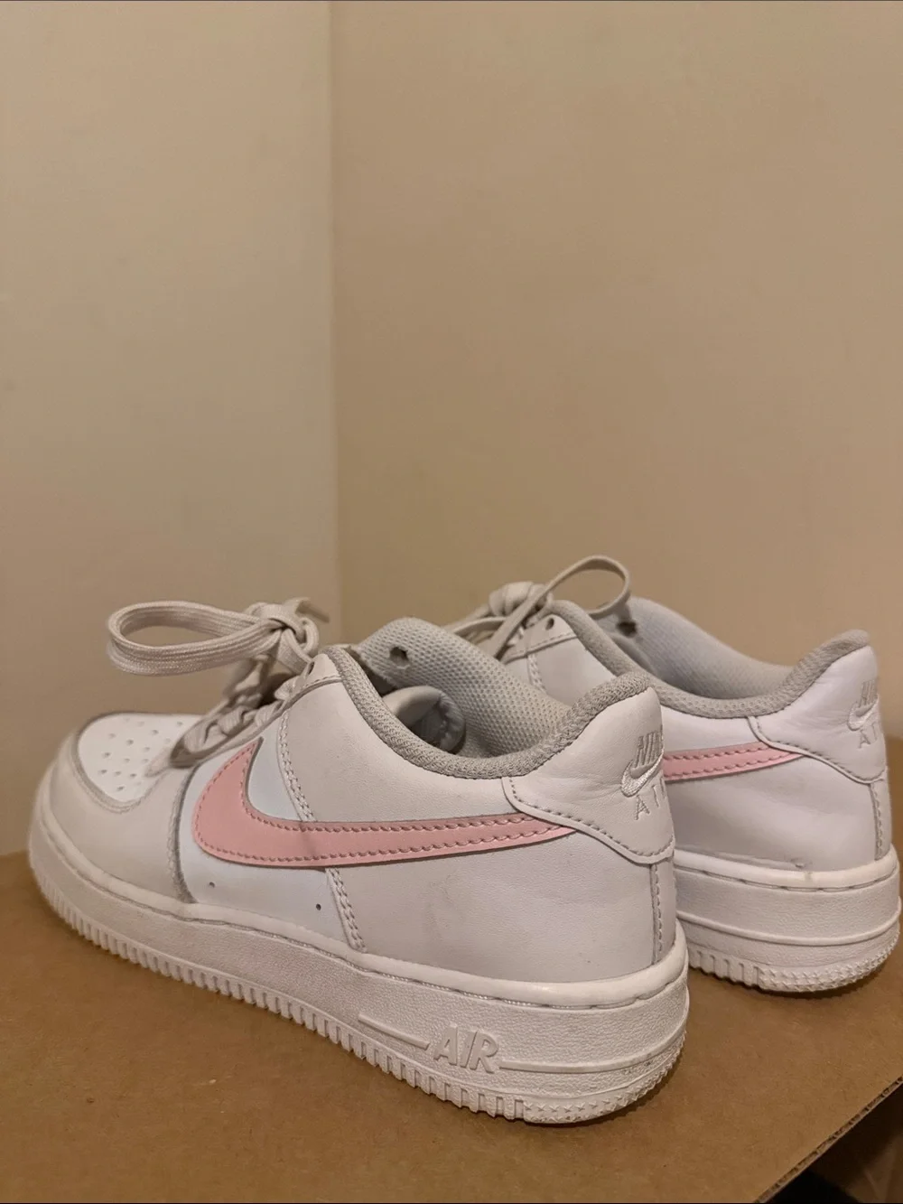 Nike White Low-Top Sneakers with Pink Swoosh
